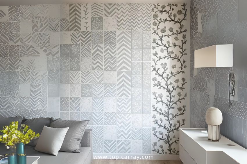 A DIY stencil art wall featuring a patchwork of light gray geometric patterns and a tall stenciled floral vine, offering a cheap alternative to custom wallpaper.